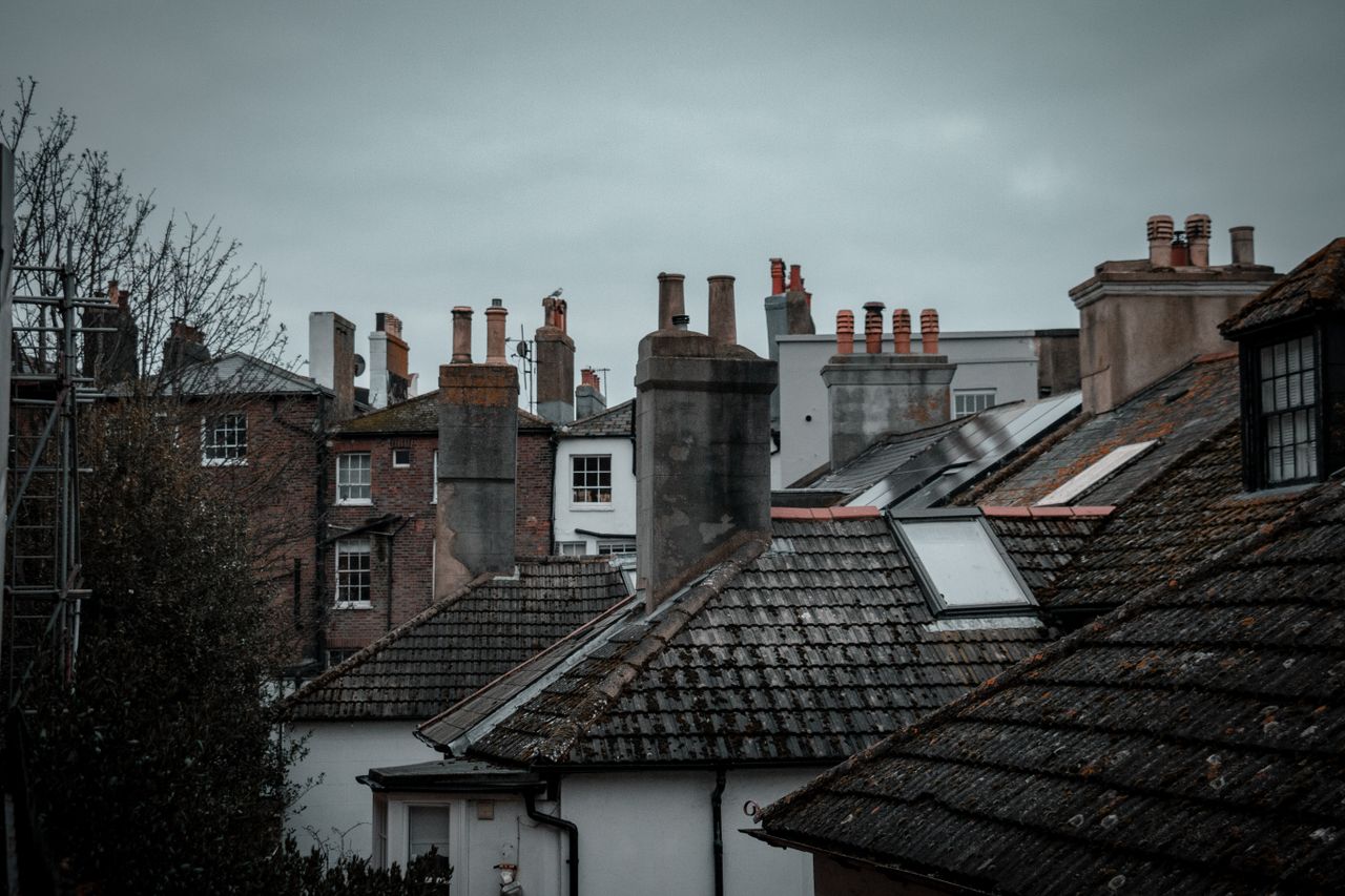 About Discover the rustic charm of rooftops in Hastings, England, featuring classic chimneys and urban architecture.